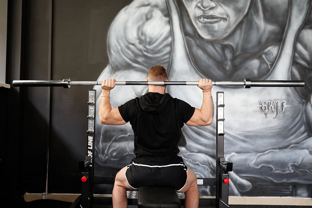 behind-the-neck barbell press - wrong - right