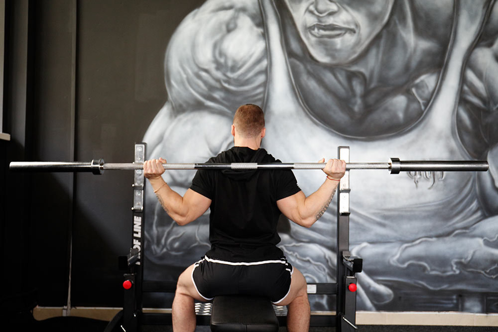 behind-the-neck barbell press - wrong